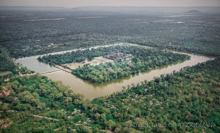 A helicopter view of the Angkor Wat and the surrounding moat and jungle.