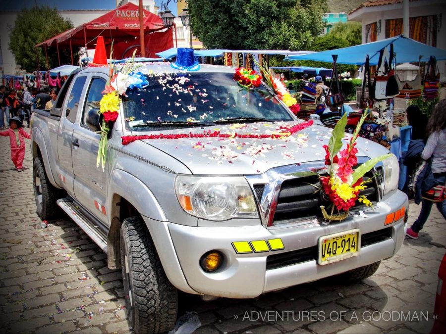 Outside of the main church in Copacabana, Bolivia, cars line up daily to be blessed and covered in holy flowers.