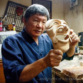 Kim Dong-Pyo demonstrates the mouth movement of his work-in-progress Nobleman mask