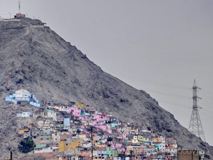 Sandy hills surround Lima and are covered with brightly-colored slums.