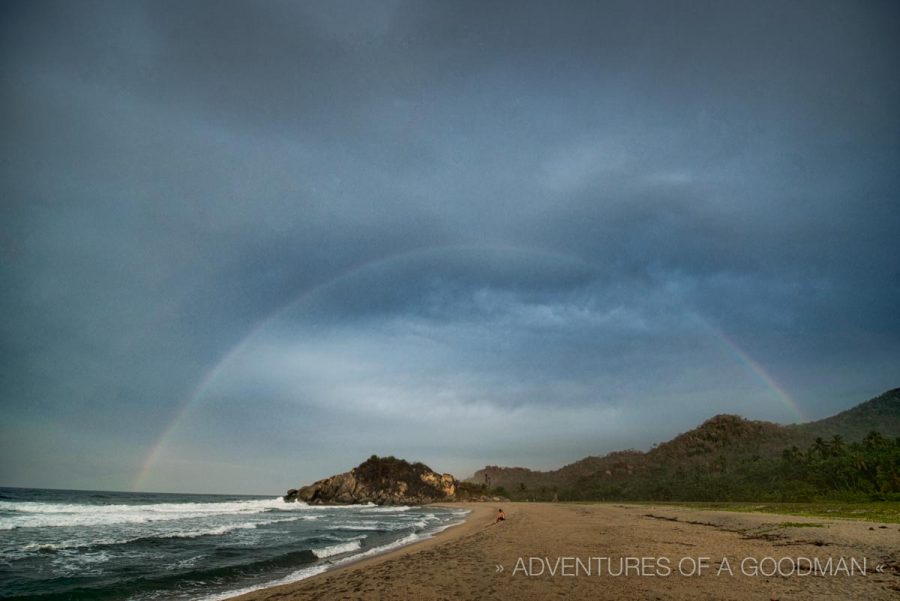 A full rainbow above the Caribbean coast at Tayrona National Park.