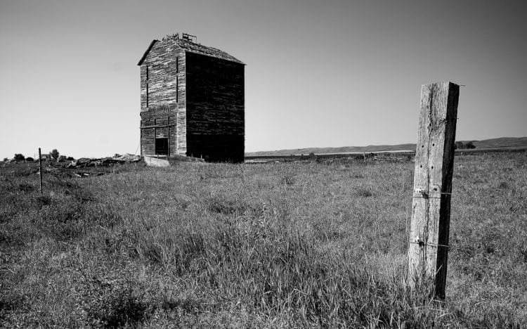 Late last summer, I went on a photo shoot along US Highway 12 between the Twin Cities of Minnesota and eastern South Dakota. As you get out of the prosperous cities, the abandoned farms and other structures pertinent to the way farming was done in the first half of the 20th Century increasingly dot the landscape. Processing this in black and white made me more mindful of the evocative photos of the Depression shot by such great American photographers as Dorothea Lange and Walker Evans.
