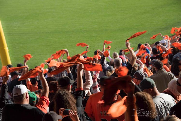 Fans attending the NLCS are given orange rally towels to spin around throughout the game.