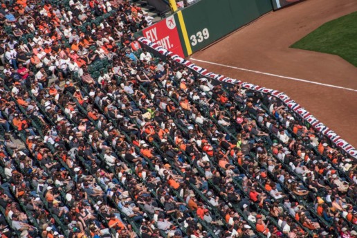 Fans in the left field watch the SF Giants play ball!