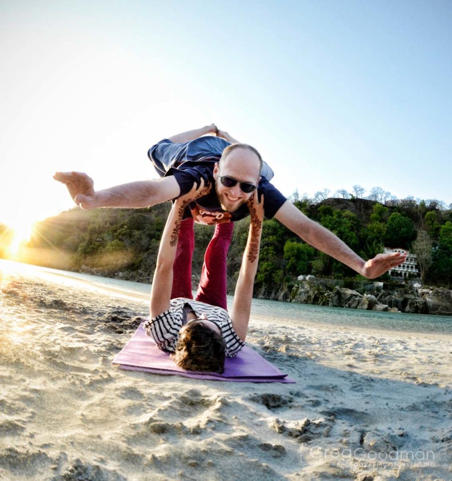 Carrie flies me during an Acro Yoga session on the shores of the Ganges River in Rishikesh