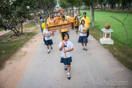 Local students march in a parade to celebrate the 86th birthday of King Bhumibol Adulyadej