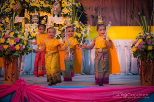Young children perform a traditional dance to celebrate the King of Thailand's 86th birthday at Sukhothai