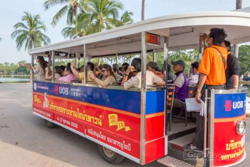 A tourist bus filled with locals in Sukhothai
