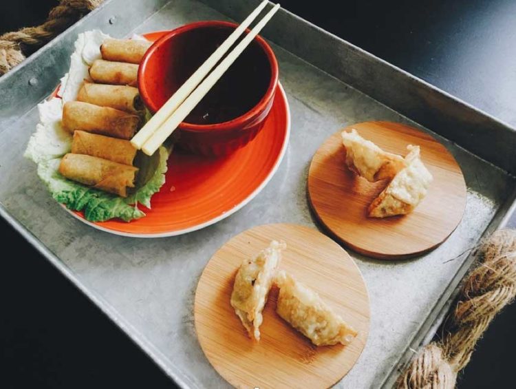 A plate of jiaozi potstickers - photo Via Pixabay