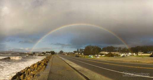 A rainbow stretches across Highway 1