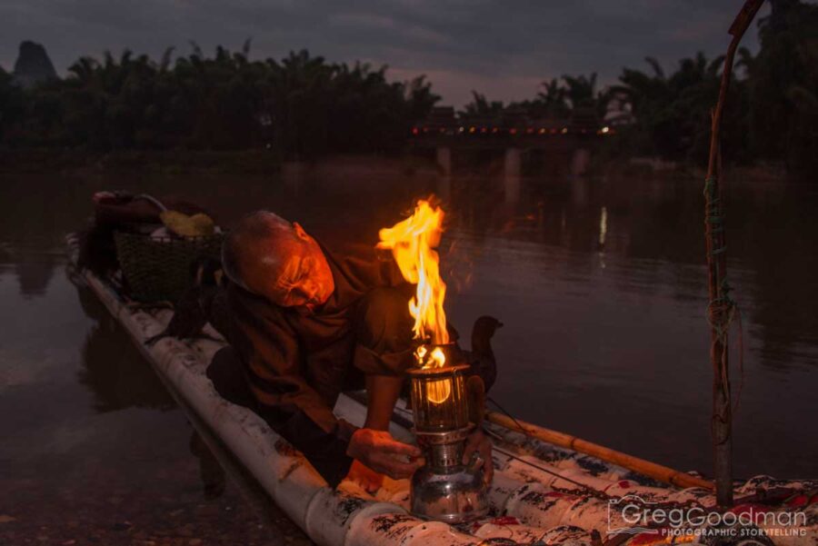 A cormorant fisherman preps for the day in Yangshou, Guangxi, China