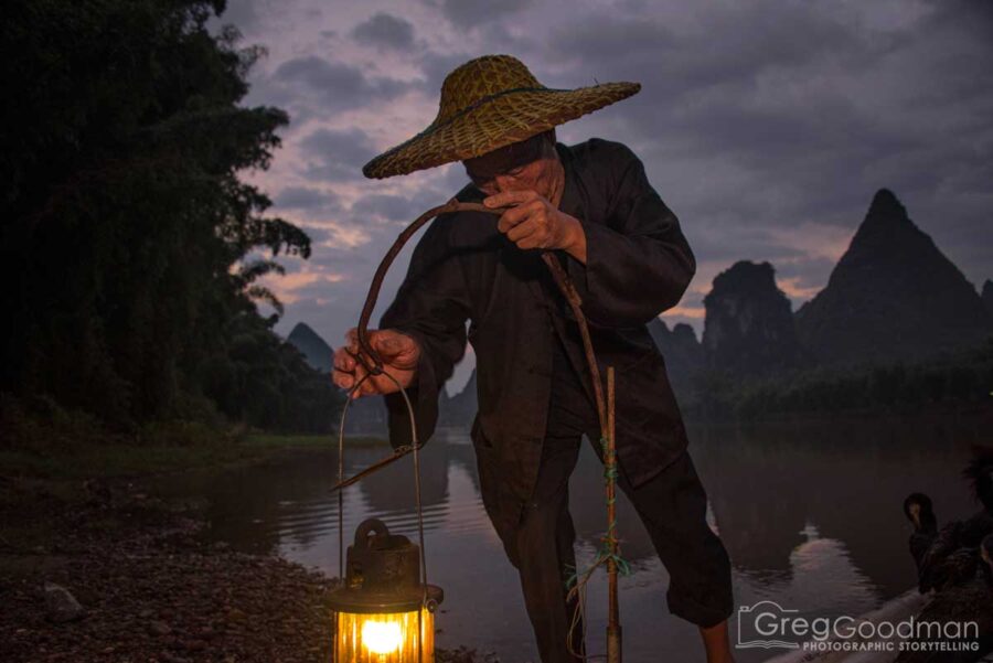 A cormorant fisherman preps for the day in Yangshou, Guangxi, China