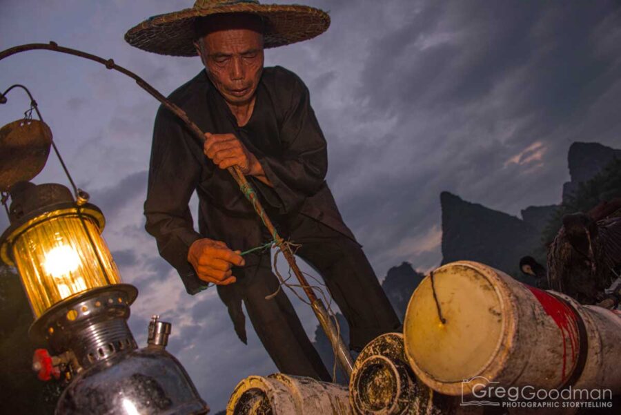 A cormorant fisherman preps for the day in Yangshou, Guangxi, China