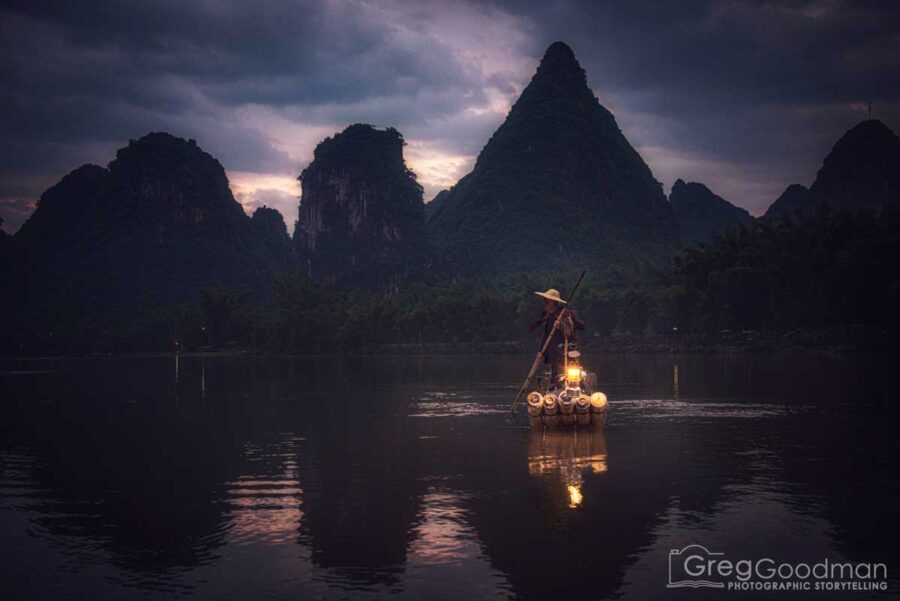 Photographing a cormorant fisherman preps for the day in Yangshou, Guangxi, China