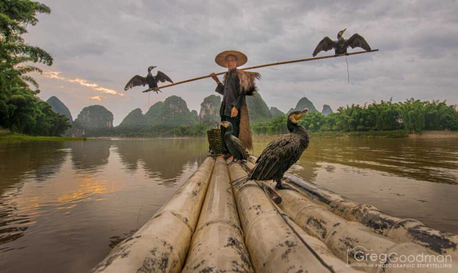 Photographing a cormorant fisherman preps for the day in Yangshou, Guangxi, China