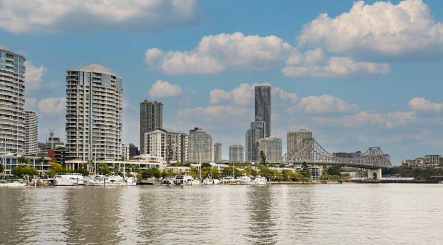 The Brisbane skyline along the river on a sunny day