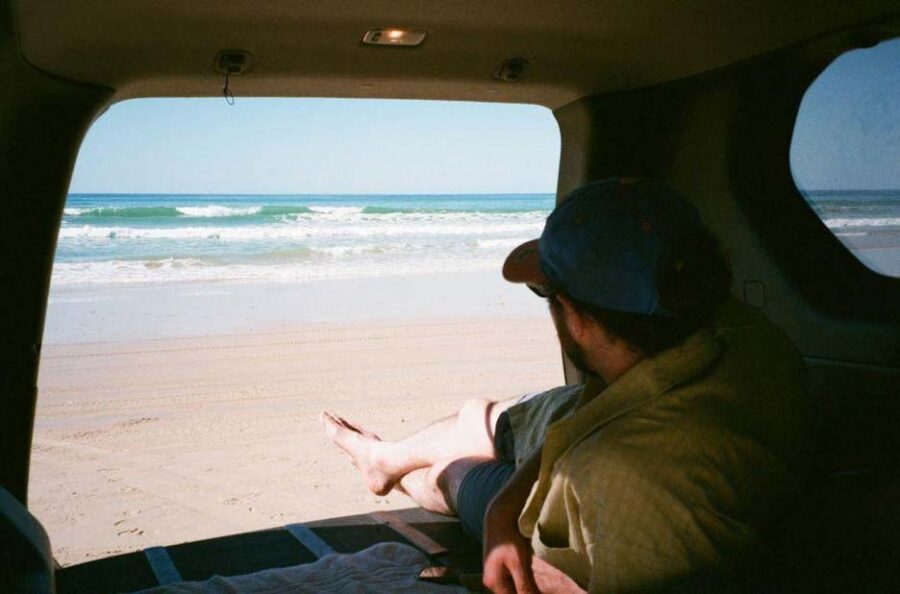 A car on a scenic coastal road in Queensland
